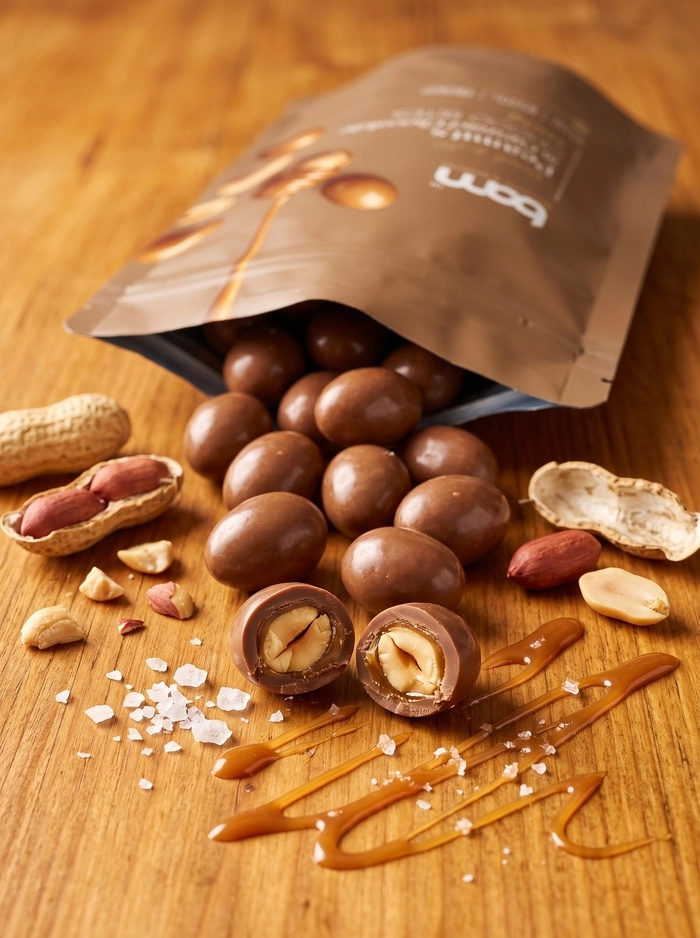 Arašidi v mlečni čokoladi s karamelo, 100 g